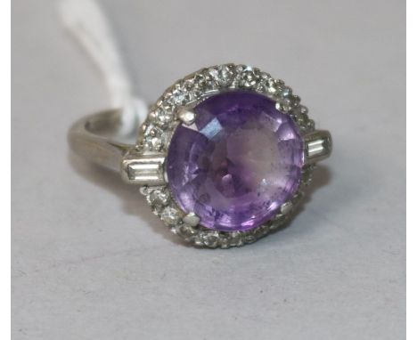 A 1920's/1930's 18ct gold and platinum, amethyst and diamond dress ring, size K.