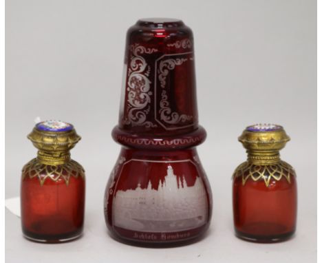 A pair of ruby glass scent bottles, a Bohemian ruby glass flask and a beaker (4) scent bottles height 8cm, glass height 15cm