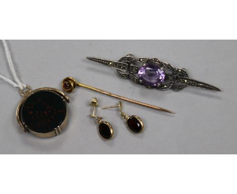 A 9ct gold and garnet stick pin, a pair garnet earrings, a yellow metal fob and a silver and marcasite brooch.