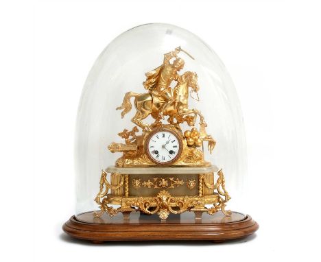 A gilt spelter mantel clock, surmounted by a soldier on horseback over trophies, an enamel dial and an ornate base, mounted w