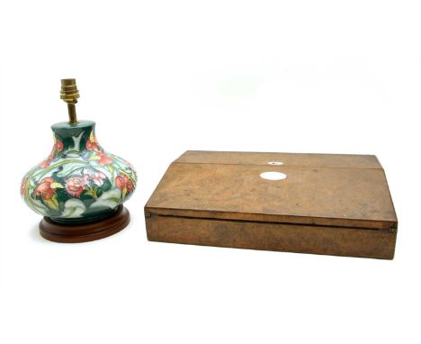 A Victorian burr walnut and coromandel writing slope, 38cm wide, together with a Moorcroft pottery lamp, 26cm high including 