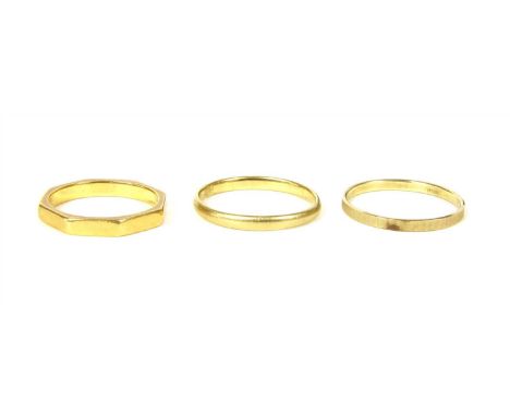 An 18ct gold court section wedding ring, Birmingham 1936, finger size Q, together with a gold octagonal shaped wedding ring, 