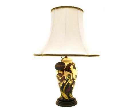 A Moorcroft pottery table lamp , in the Foxglove pattern, having original shade, lamp base, 38cm high, with shade, 60cm high,