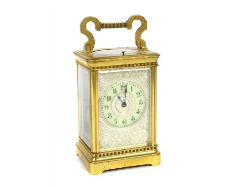 A carriage clock, with a silvered face and repeating mechanism, 15cm high