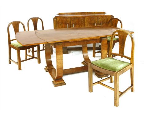 An Art Deco walnut dining suite, comprising: a draw-leaf dining table, raised on curved supports, 120cm long, 182cm extended,