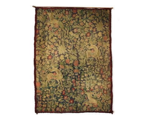 A French tapestry panel, depicting deer amongst trees, with purple fringing, on a rail, 175 x 125cm