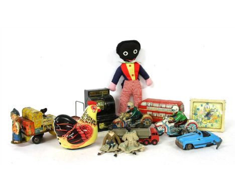 A quantity of vintage toys , to include a British tinplate clockwork luggage handler, wearing a British Rail cap with luggage