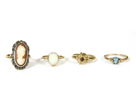 A 9ct gold opal ring, with an oval cabochon opal, rub set to a plain shank, Edinburgh 1978, finger size M, together with a 9c