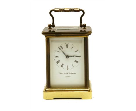 A modern brass carriage clock, by Matthew Norman
