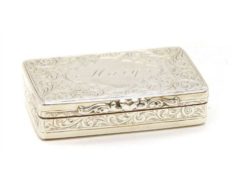 A Victorian silver snuff box , London 1867, maker's mark for George Unit, the rectangular box with chased scrolling foliate d
