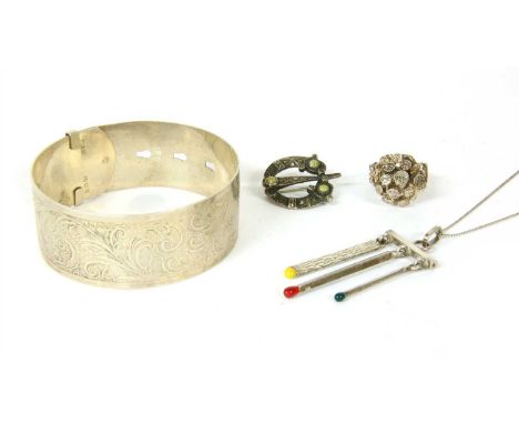 A large quantity of silver jewellery, to include a sterling silver engraved buckle bangle, London 1945, a sterling silver abs