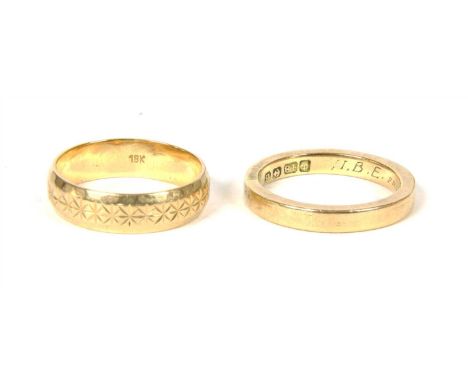 An 18ct gold flat section wedding ring, with hand engraved inscription, size K LE, and a diamond cut wedding ring marked 18k,