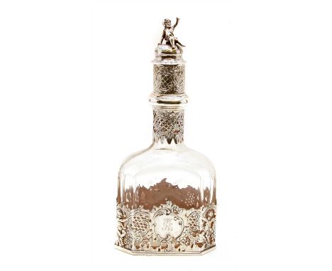 A Dutch silver mounted liqueur decanter , import marks for London 1895, sponsors, mark SH, the glass body with pierced and ra