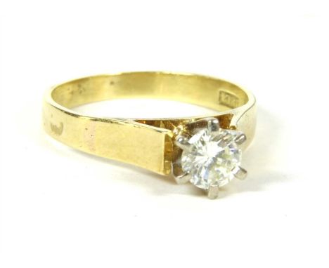 A single stone diamond ring, estimated as approximately 0.49ct, six claw set to a white wigwam collet, to flat section open s