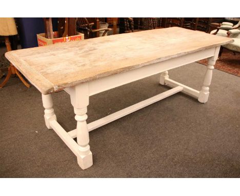 A refectory style kitchen table , with a white painted base and a limed oak top, 220cm wide, 85cm deep, 78cm high, together w