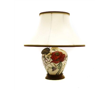 A Moorcroft pottery table lamp , in the 'Family Through Flowers' pattern, having original shade, lamp base 28cm high, with sh