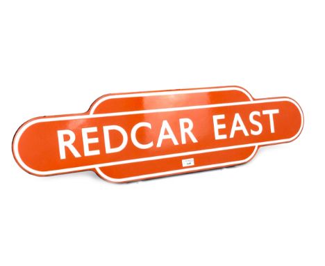 NORTH EASTERN RAILWAYS ENAMEL TOTEM - REDCAR EAST, single sided, white lettering on an orange ground, 26cm x 92cm  Redcar Eas
