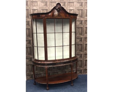 MAHOGANY BOW FRONT DISPLAY CABINETOF CHIPPENDALE DESIGN, the moulded cornice with central shell cresting, two glass shelves b