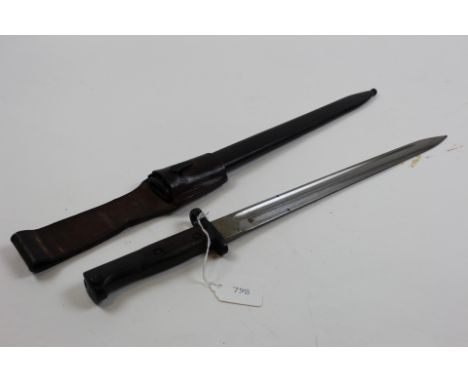Bayonet: An unmarked Mauser export bayonet for the Colombian Mauser/Model 1924/30. In its steel scabbard with leather frog. 