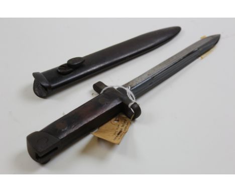 Bayonet: Italian Model 1938 Carcano knife bayonet in its steel scabbard. Sound condition overall. 