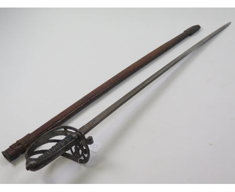 Sword: An 1827 Pattern Rifle Officers sword by Henry Wilkinson Pall Mall, London in its leather field service scabbard. Good 