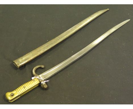 Bayonet: French Model 1866 Sabre bayonet by St Etienne and dated 1872. In its matching steel scabbard. Decent example. 