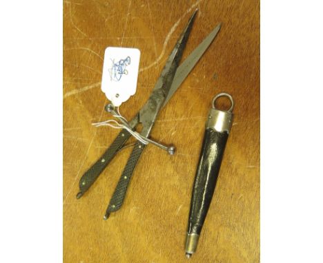 Knife: An unusual pair of scissors in the shape of a dagger and marked ''The Bircham Dagger Scissors'' In its leather scabbar