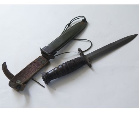 Bayonet: U.S. M4 Knife bayonet in plastic scabbard, locket faintly marked 'U.S.M.C. with leg tie. (popper a/f). Sound conditi