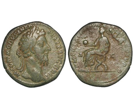 Commodus sestertius, Rome Mint 186 A.D., reverse:- Commodus seated left on curule chair, holding globe and scroll, being crow