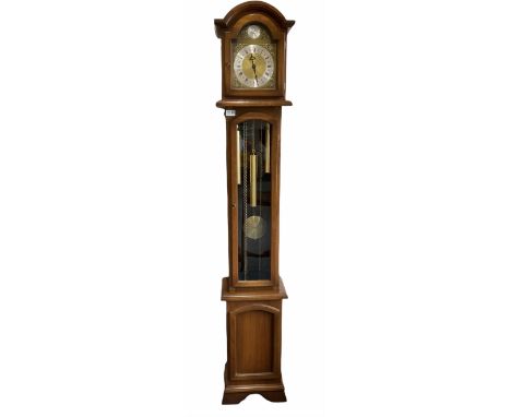 A weight driven 20th century �Grandmother� clock striking the hours and quarters on gong rods, hood with a break arch pedimen
