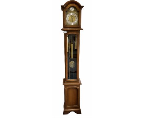 A weight driven 20th century �Grandmother� clock striking the hours and quarters on gong rods, hood with a break arch pedimen