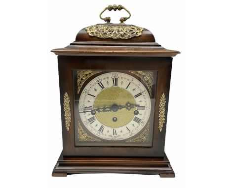A 20th century three train mantle clock in the style of an 18th century bracket clock, case with an inverted bell top and bas
