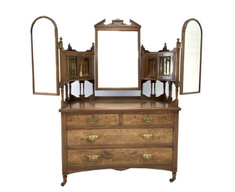 Late Victorian figured walnut dressing chest, two bevel glazed cupboards with arched swing mirrors raised on spindle gallerie