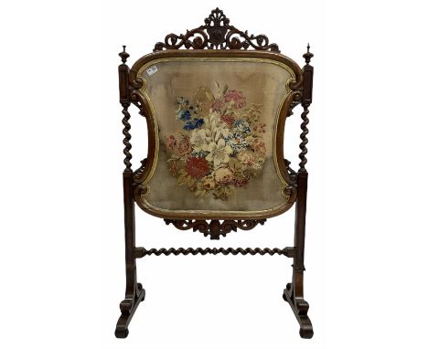 Victorian rosewood fire screen, pierced and scroll carved pediment centred by cartouch over glazed floral needlework upholste