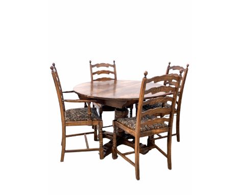 18th century style oak dining table, the circular top with one additional leaf housed under raised on a leaf carved baluster 