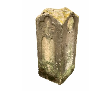 'The art of the Stonemason' - A York stone totem, with vaulted top over square body carved with masks, two alphabets in gothi