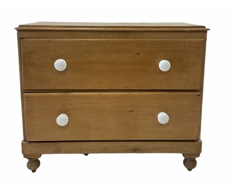 Victorian pine chest fitted with two deep drawers and ceramic pull handles, raised on turned supports W102cm, H87cm, D47cm 