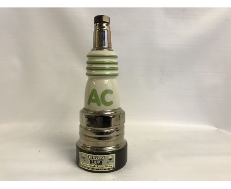 A large AC Spark Plug porcelain Jim Beam decanter, in good condition. 