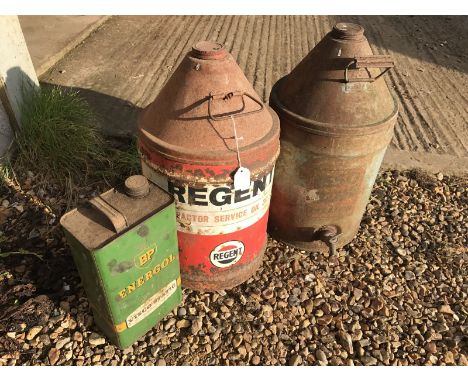 A Regent Tractor Service Oil five gallon conical can, an Essoblue Paraffin conical can with dispensing tap and a BP Energol g