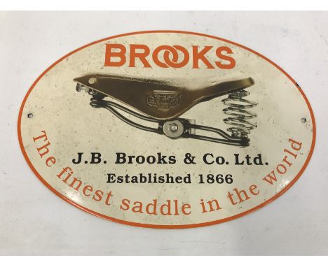 An older reproduction 'Brooks Saddles' oval enamel sign, 12 3/4 x 9". 