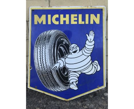 A Michelin pictorial enamel sign depicting Mr. Bibendum rolling a tyre, dated 1959, 25 1/2 x 30". 