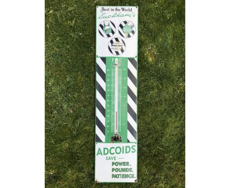 A Duckham's Adcoids black and white enamel thermometer, 11 x 45 1/4".