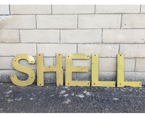A group of five enamel letters that spell the word Shell, height approx. 14 1/2" tall.