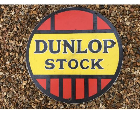 A Dunlop Stock circular double sided enamel sign, 23 3/4" diameter. 
