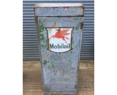 A Mobiloil oil cabinet with enamel sign to the front.