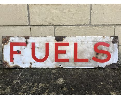 A rectangular enamel sign - 'Fuels' 35 x 9 3/4".