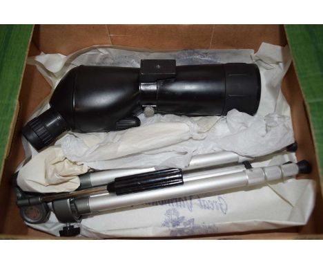 Box containing a photographic lens and tripod