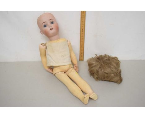 A box containing a vintage doll marked Catterfelder Puppen Fablic No 4 with wig