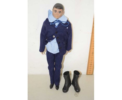 An action man figure in naval uniform with pair of boots seperategood condition