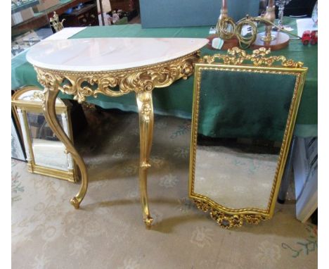 A giltwood console table and mirror, with faux marble top and a small arch topped gilt wall mirror.